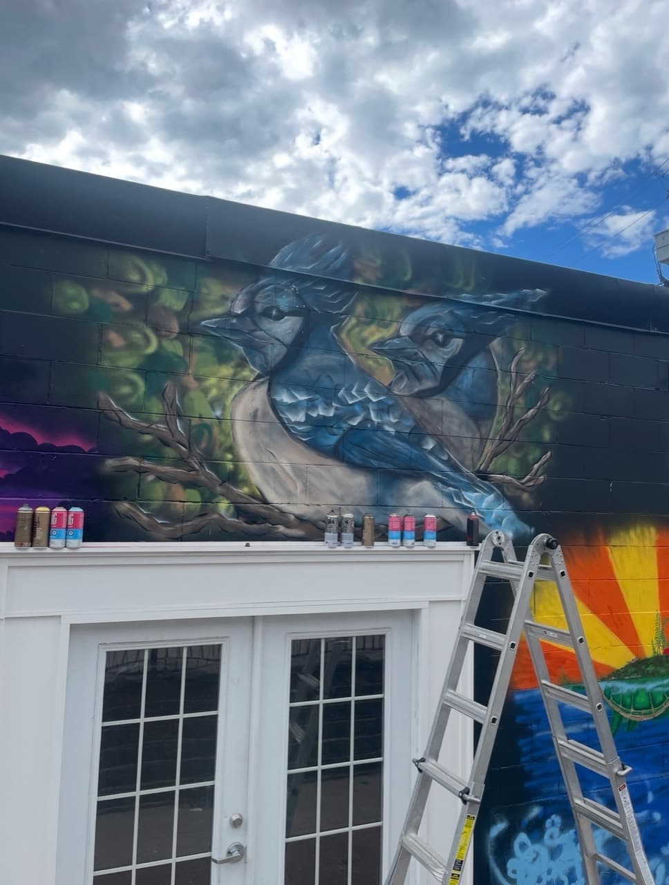 Blue Jays mural painted on a black exterior wall